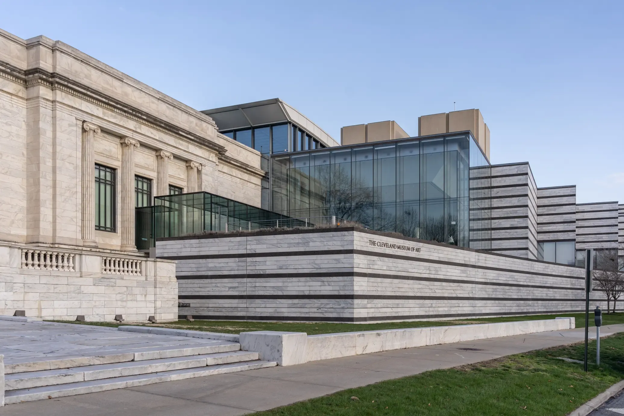Exterior view of the Cleveland Museum of Art with classical columns and modern glass facade