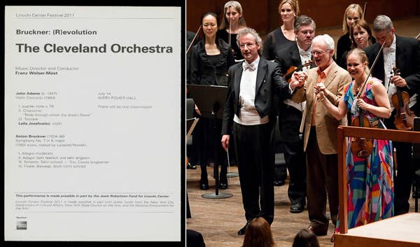 : concert program with text: Bruckner Revolution. The Cleveland Orchestra. Three smiling people hold hands onstage. A large group of musicians stands behind them.