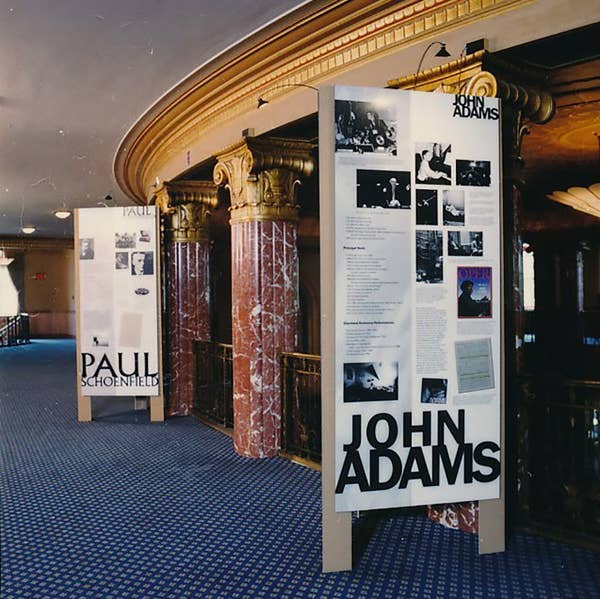 A long interior shot of a building with large poster panels.