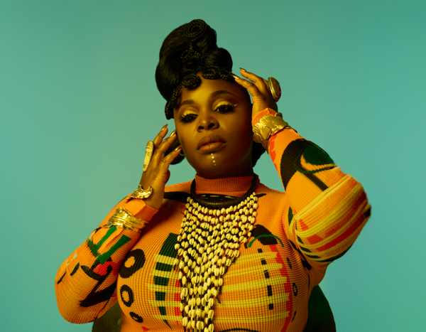 Tank Ball posing on a green background