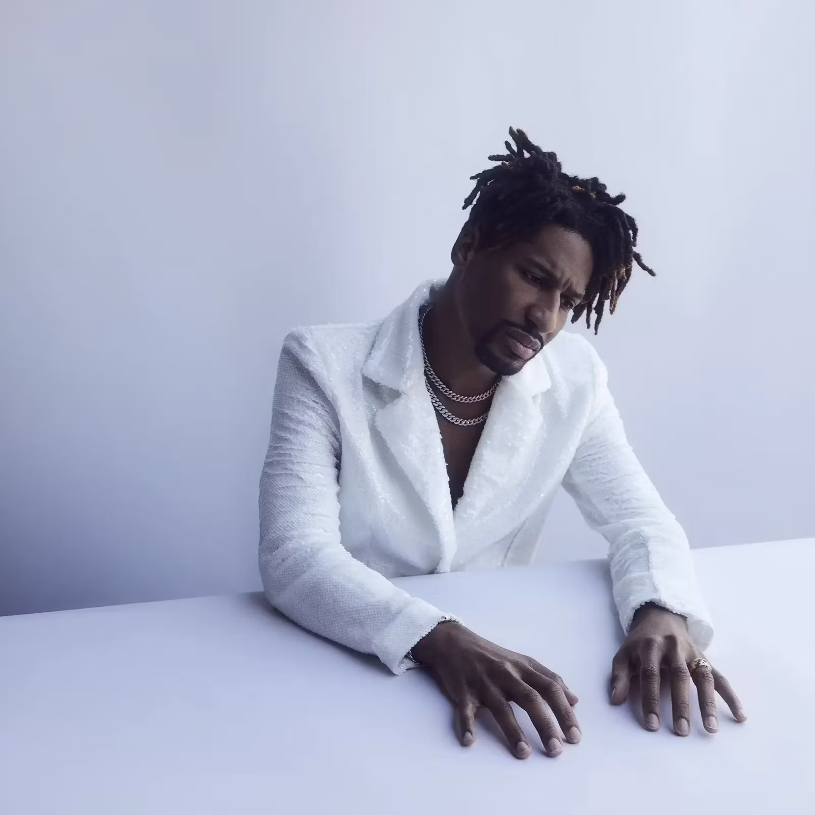 Jon Batiste in white blazer