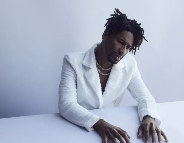 Jon Batiste in white blazer