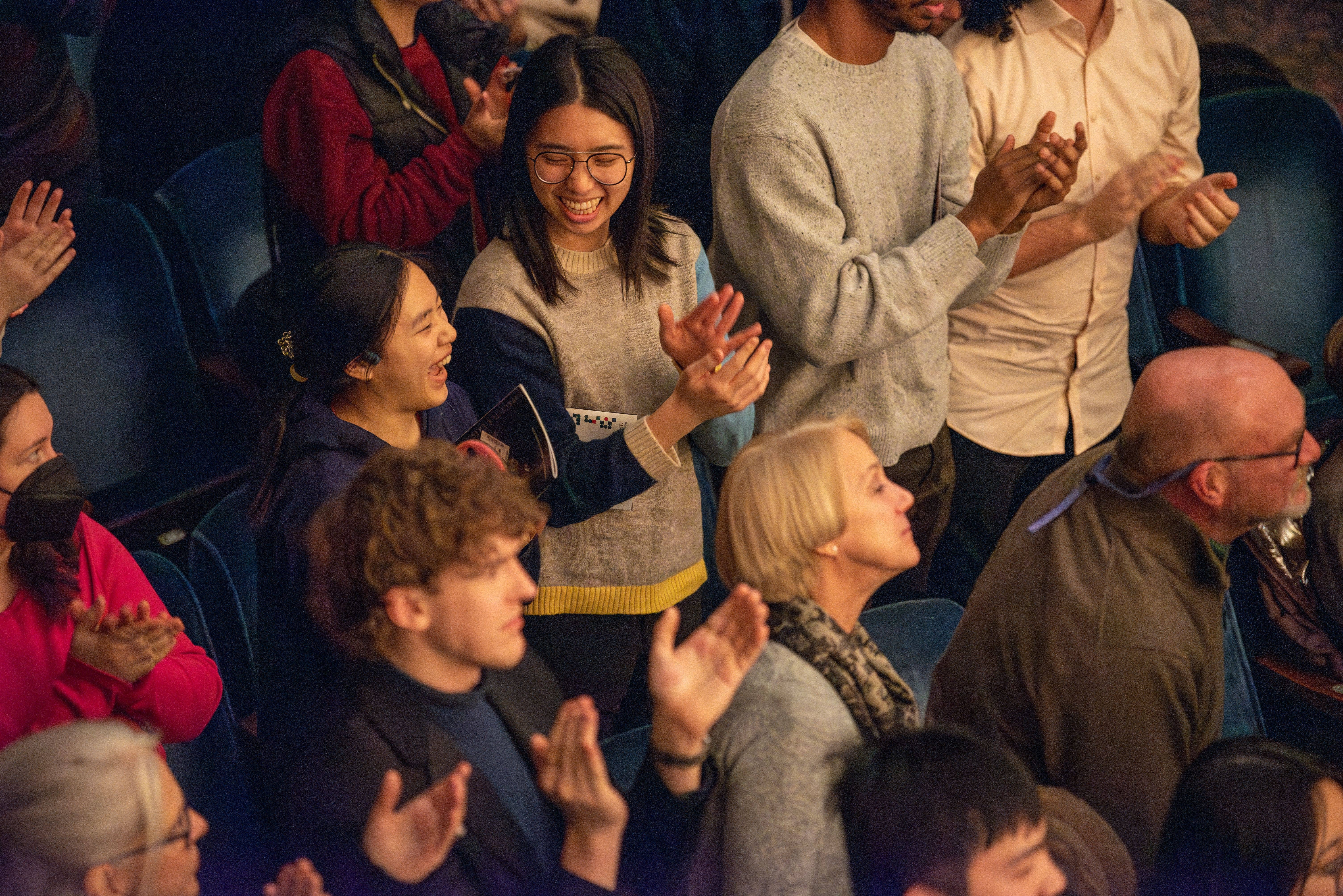 audience members clapping