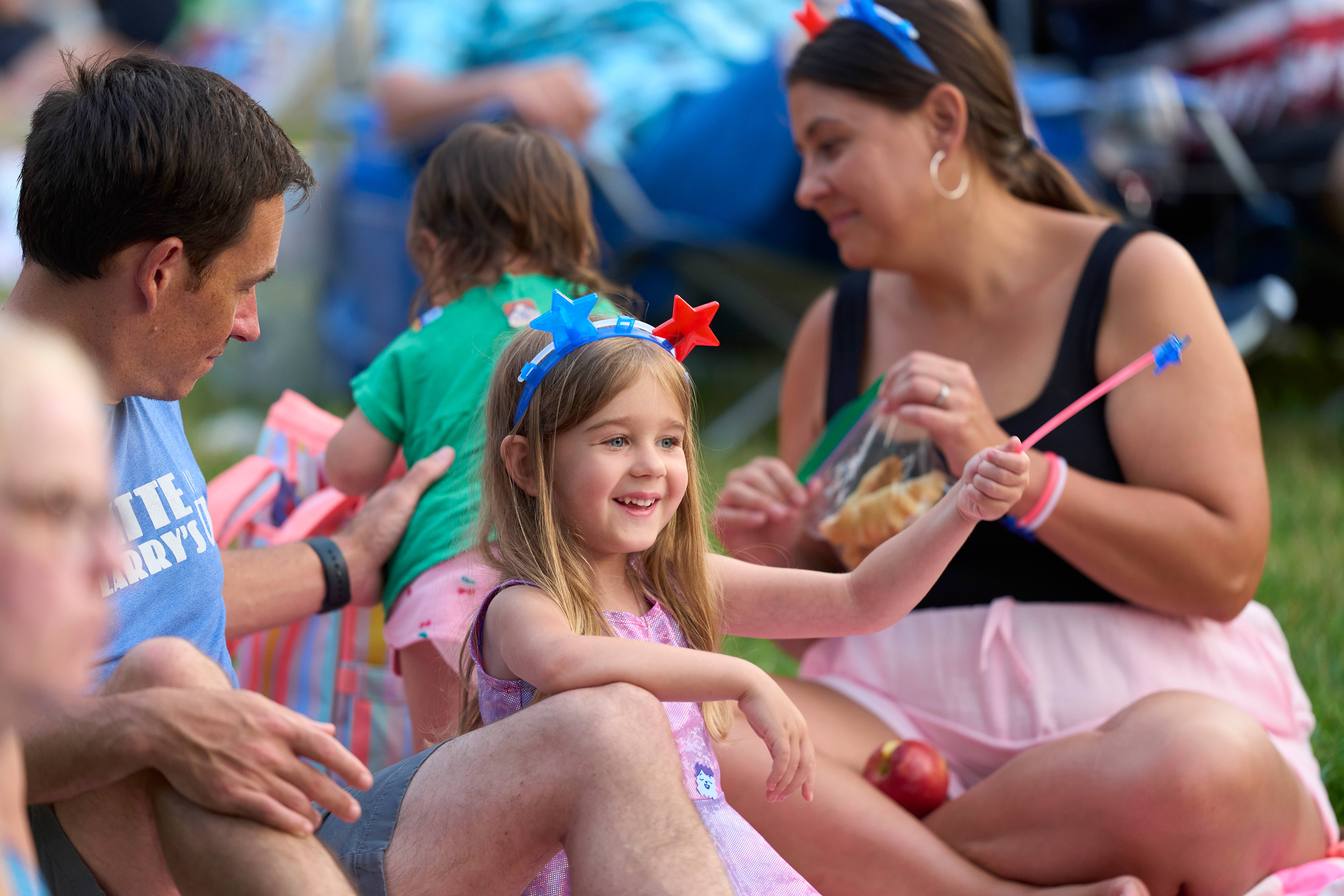 Family enjoys a concert on the lawn at Blossom Music Center