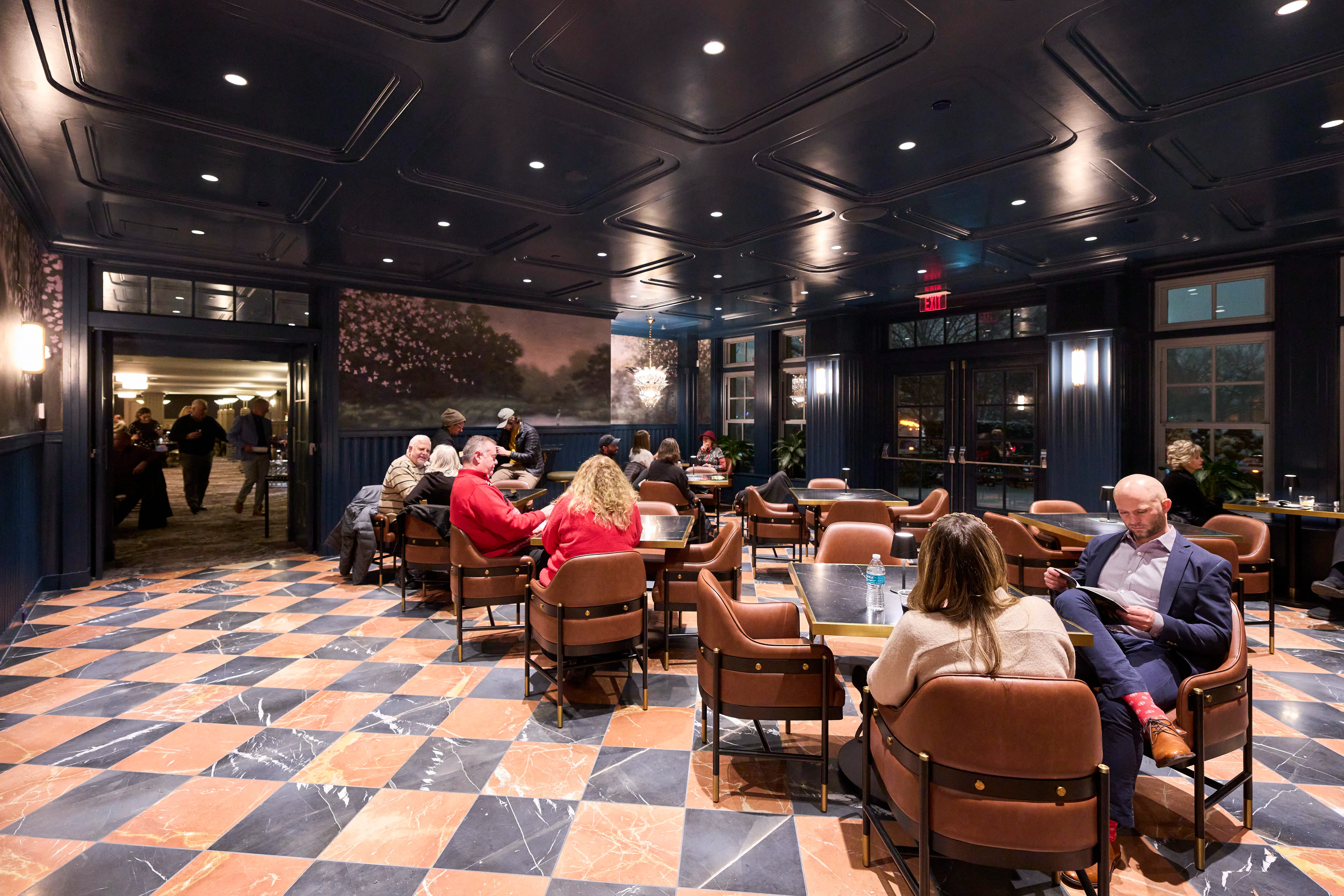 patrons in chairs at tables enjoying the Suzanne and Paul Westlake Terrace Room