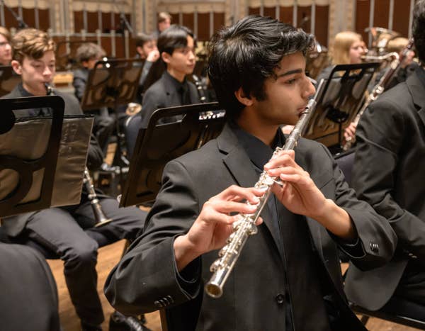 COYO musician playing flute