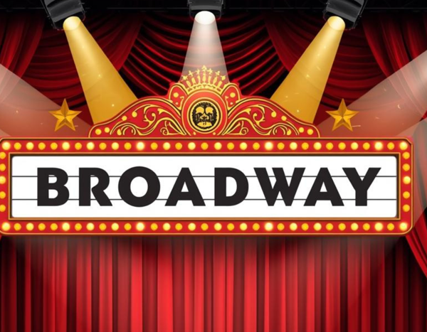 Stage banner reading Broadway with gold drums, red curtains, and spotlight arcs overhead.