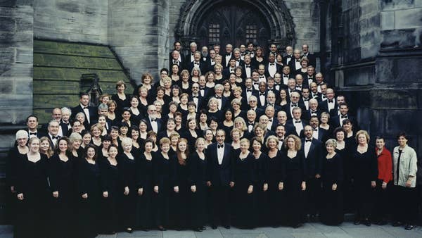 A posed picture of the Cleveland Orchestra Chorus with Porco (front-center) on their Edinburgh Tour – 2000