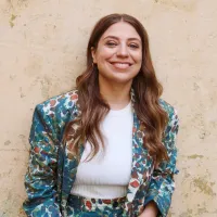 Dalia standing in front of a wall