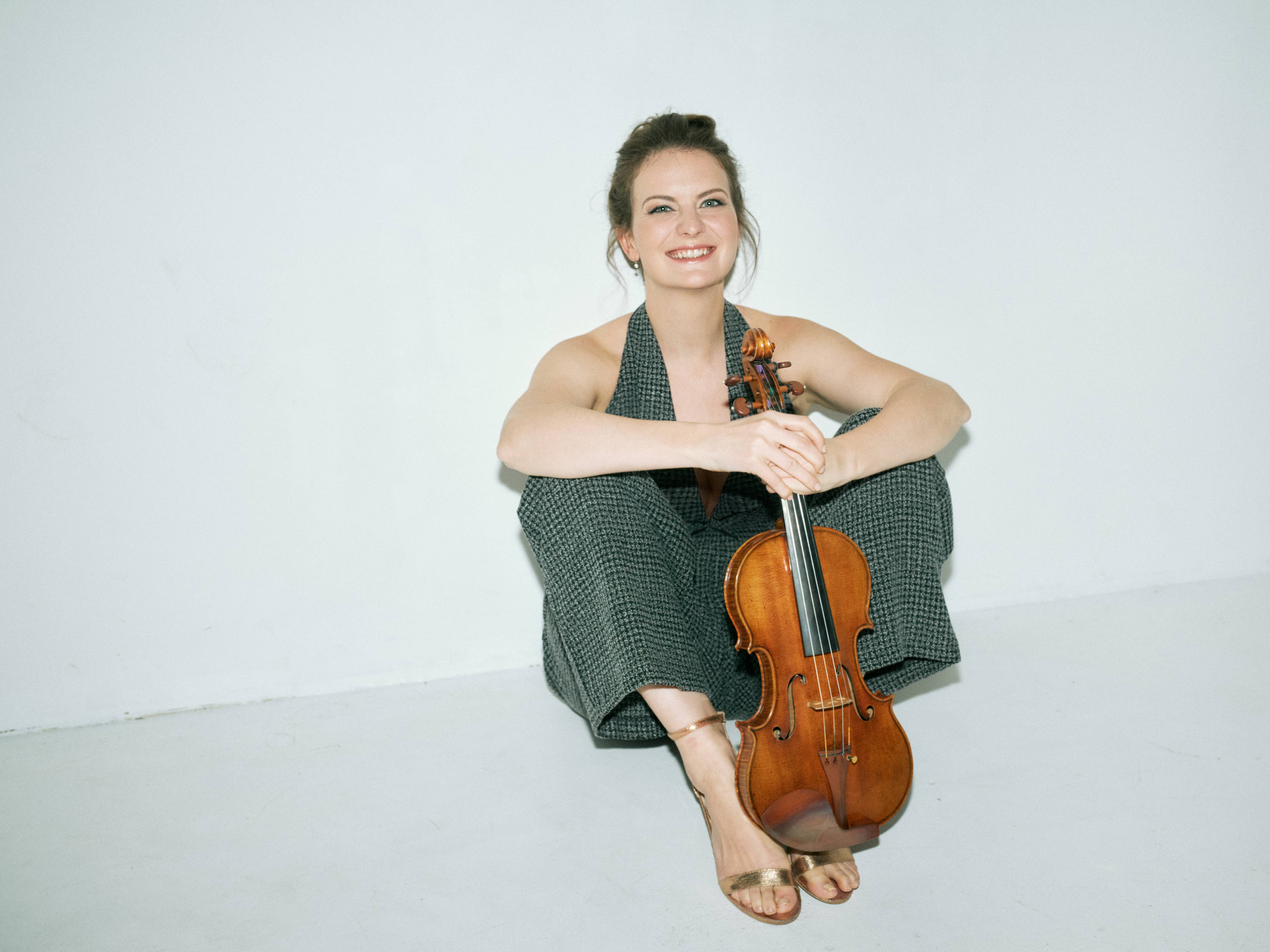 Veronika Eberle holding a violin