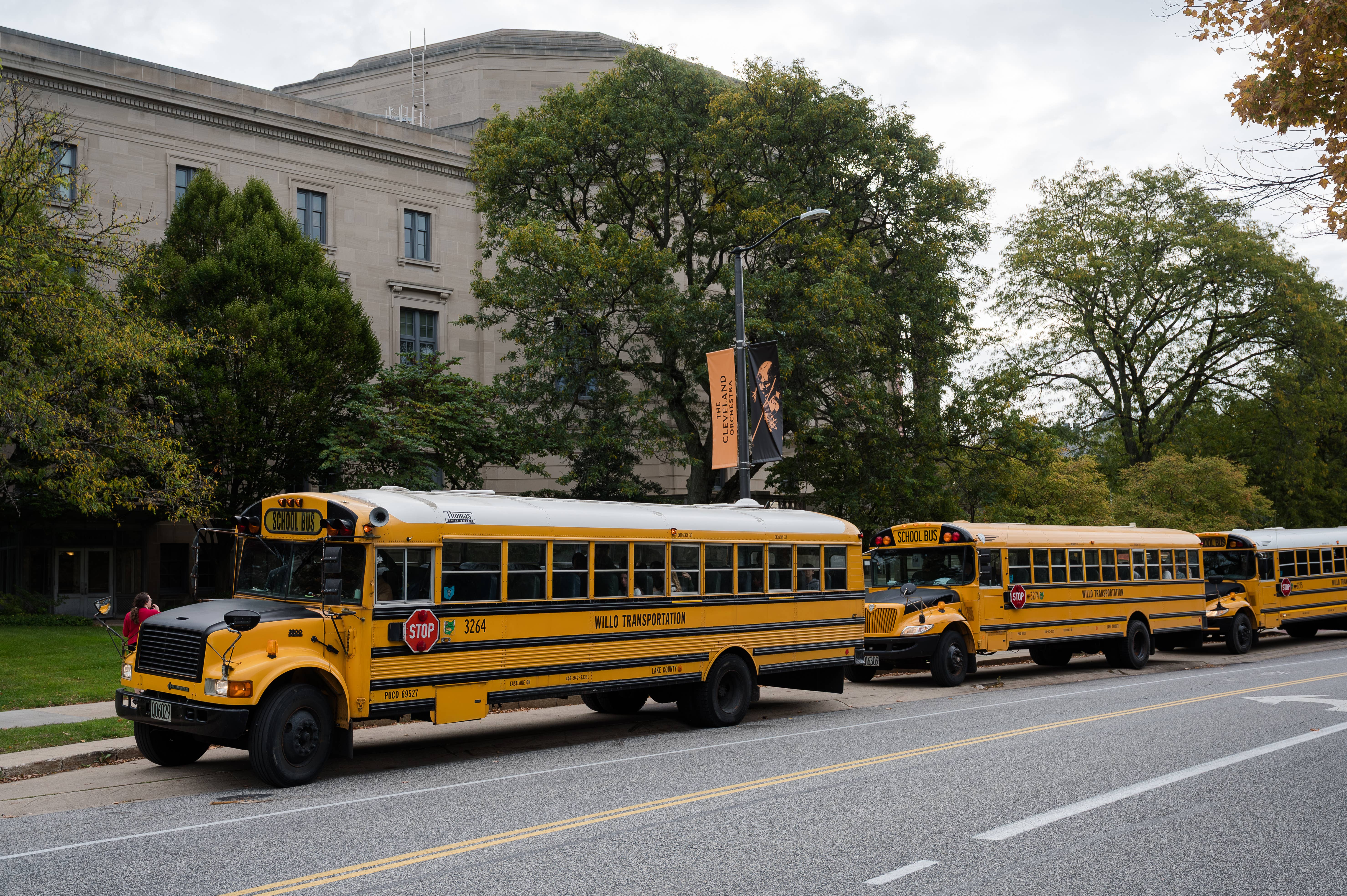 Yellow school buses parked in front of Severance Music Center