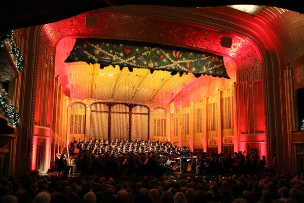 Lisa Wong leads choristers during the 2019 Holiday Concert on the elaborately decorated Severance stage.