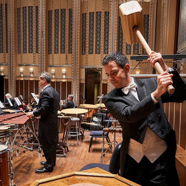 Principal percussionist Marc Damoulakis wielding the hammer.