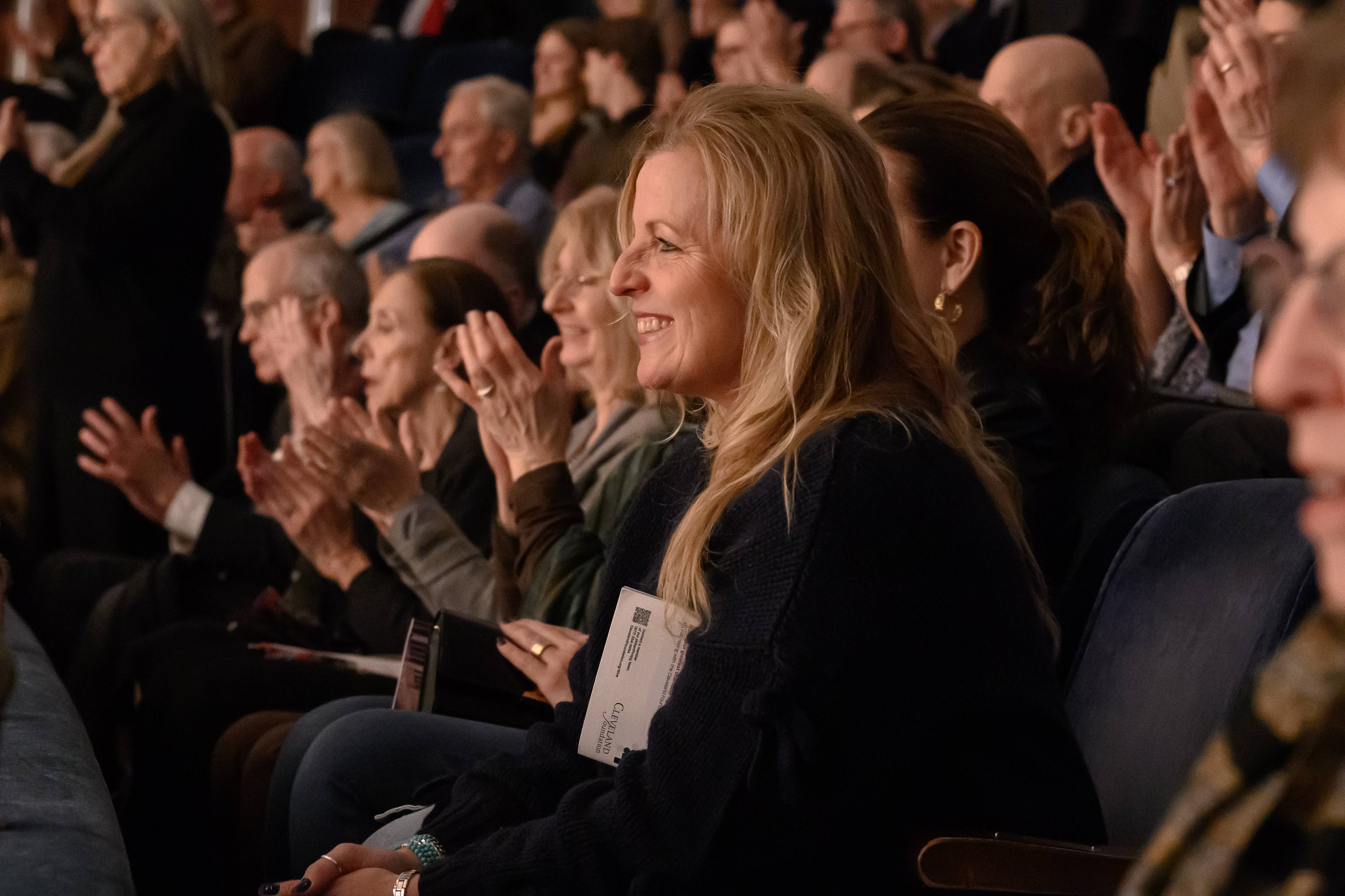 audience members clapping in Mandel Hall box seats