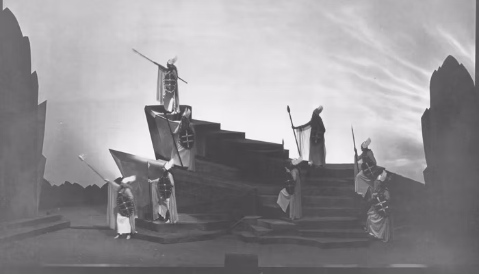 eight actors holding spears and shields pose of angular steps