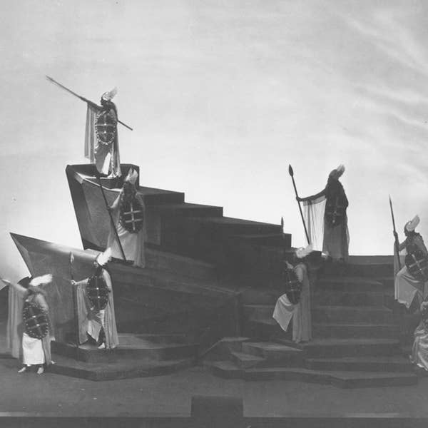 eight actors holding spears and shields pose of angular steps