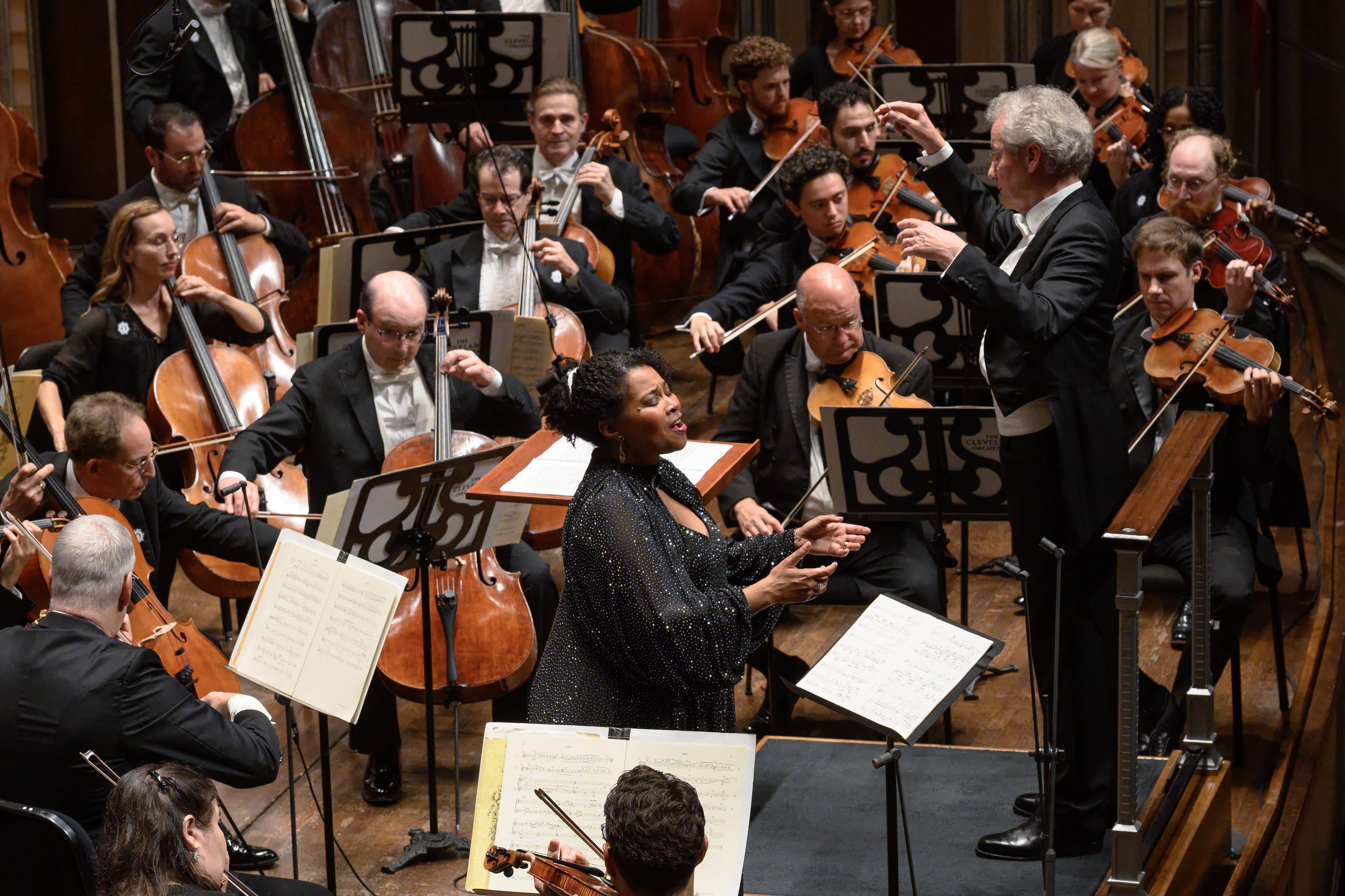 Orchestra in concert with a conductor and musicians playing string instruments onstage. 2026-09-17 - FWM Golda Schultz Four Last Songs by Yevhen Gulenko