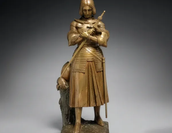Bronze armored statue of a medieval knight holding a staff, with “The Cleveland Museum of Art” text and logo