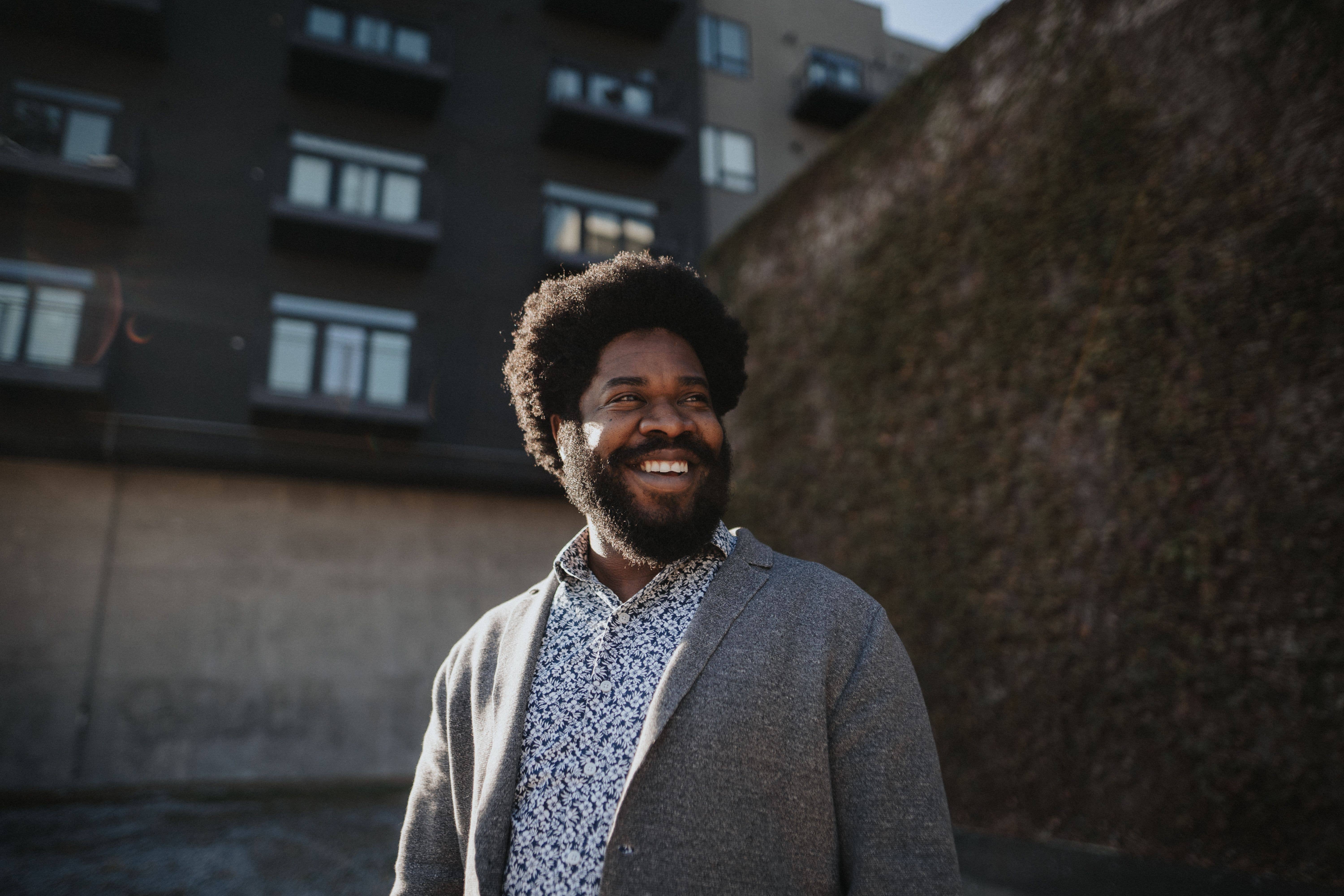 Dasha Burton standing near brick wall