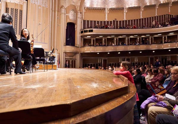 Girl leaning on concert stage before performance