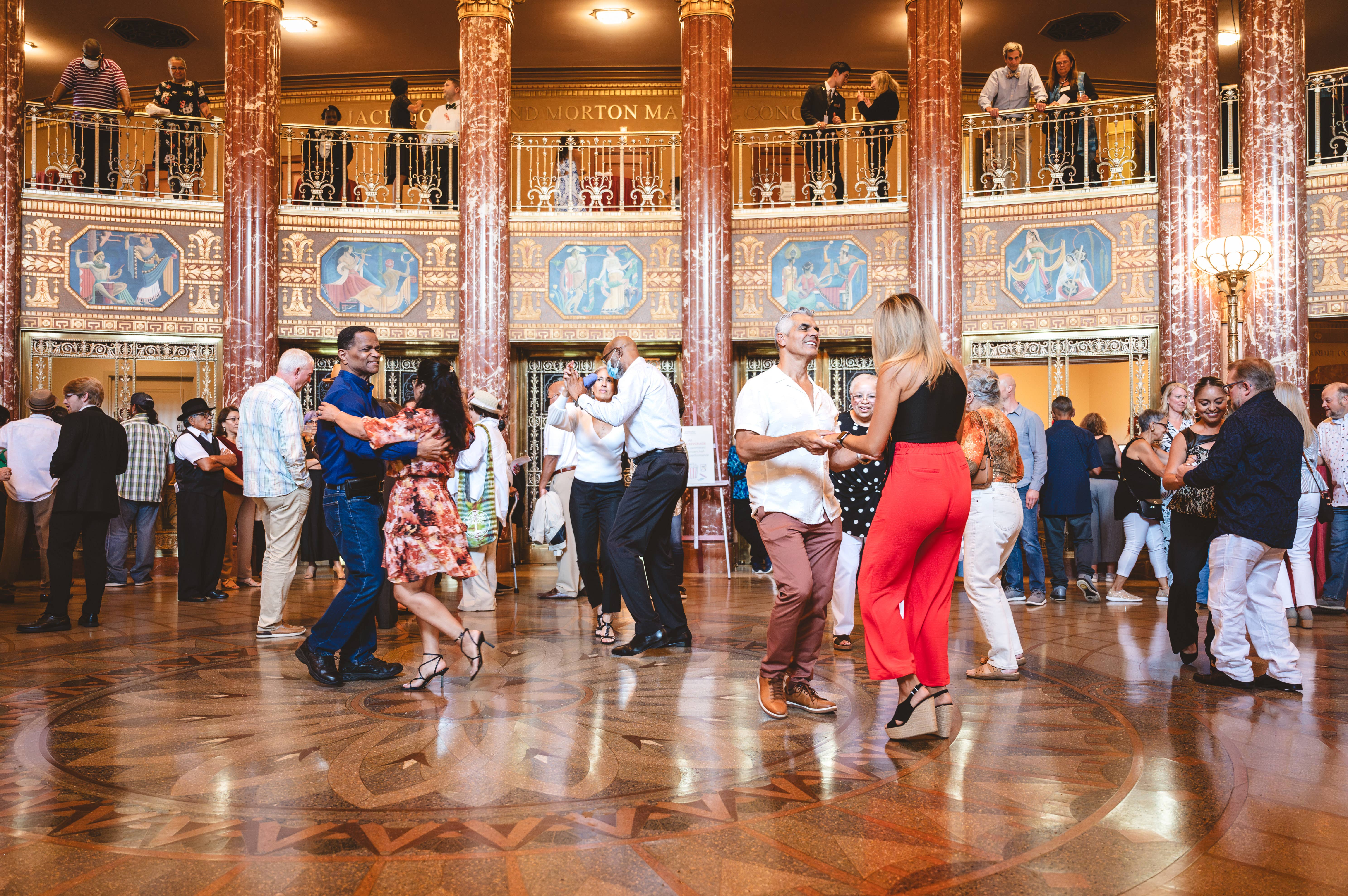 People dancing in grand foyer