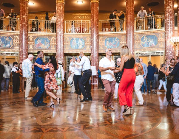 People dancing in grand foyer