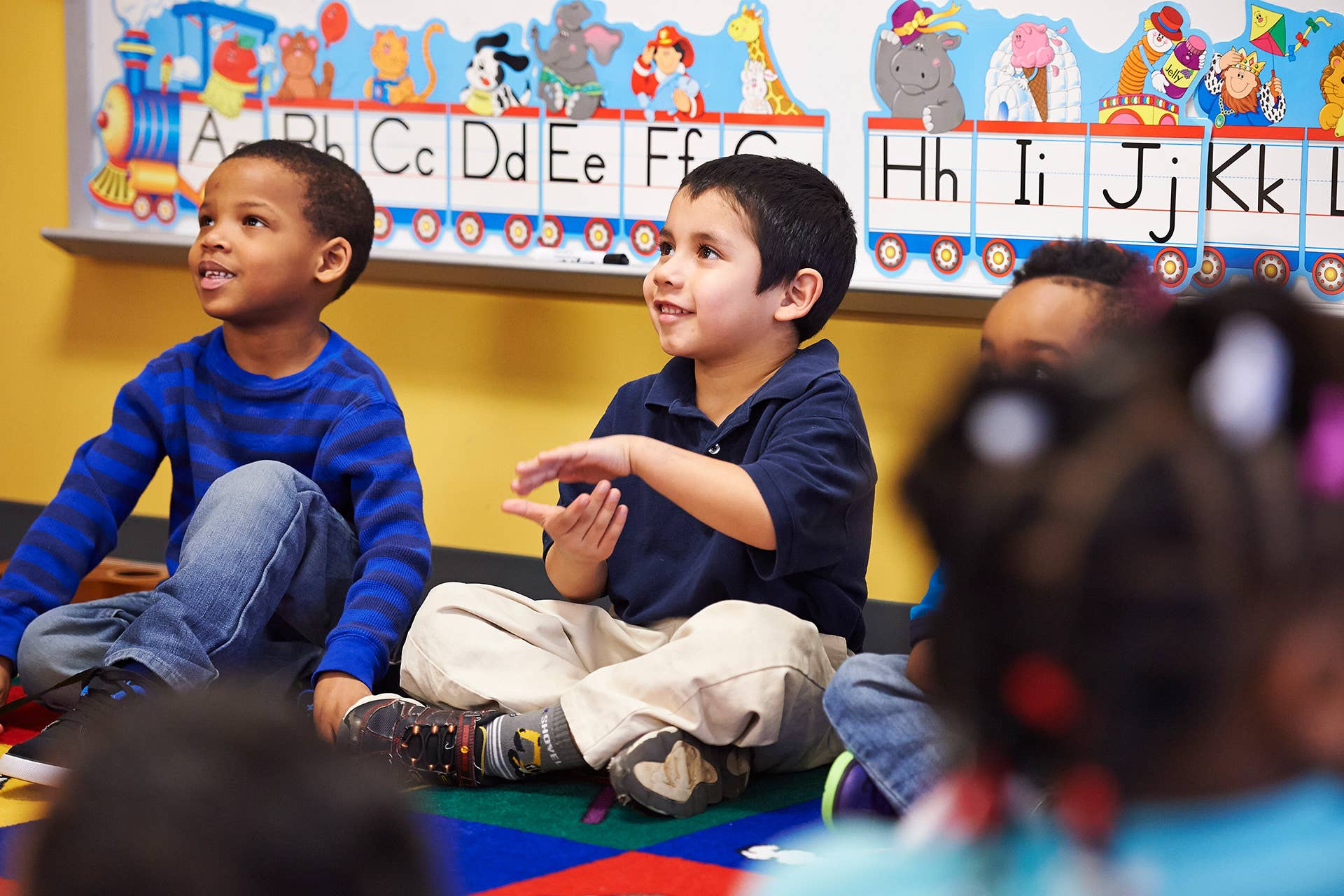 children sitting in a classroom 