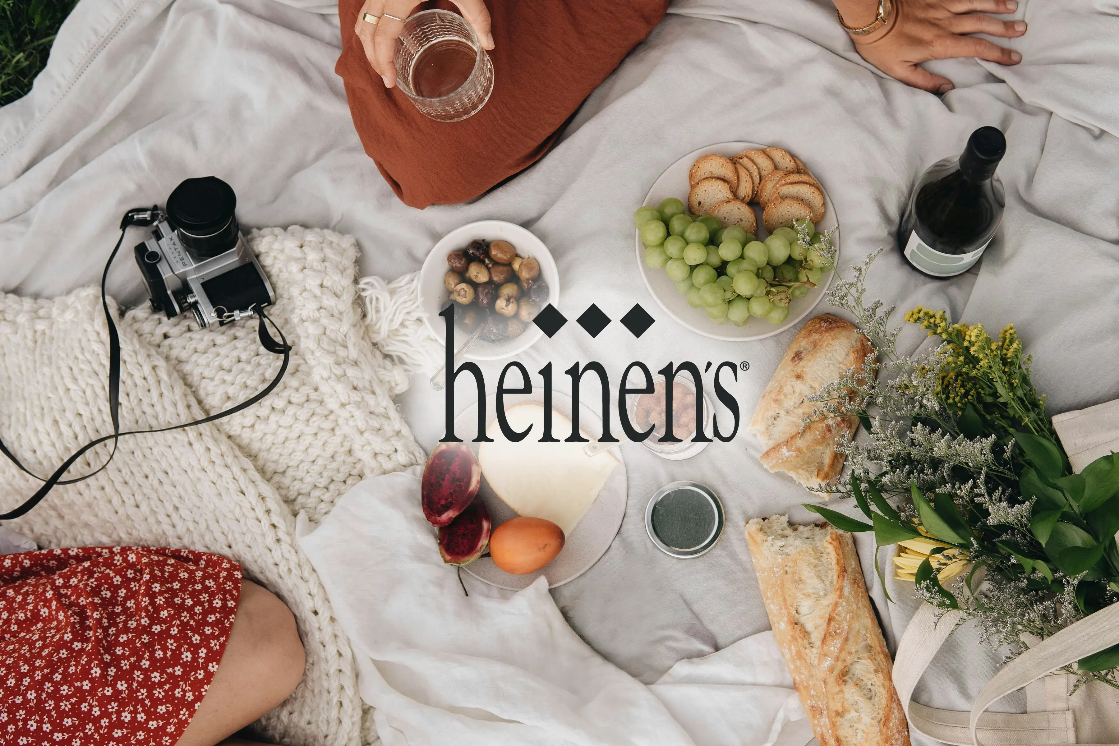 picnic blanket with Heinen's logo