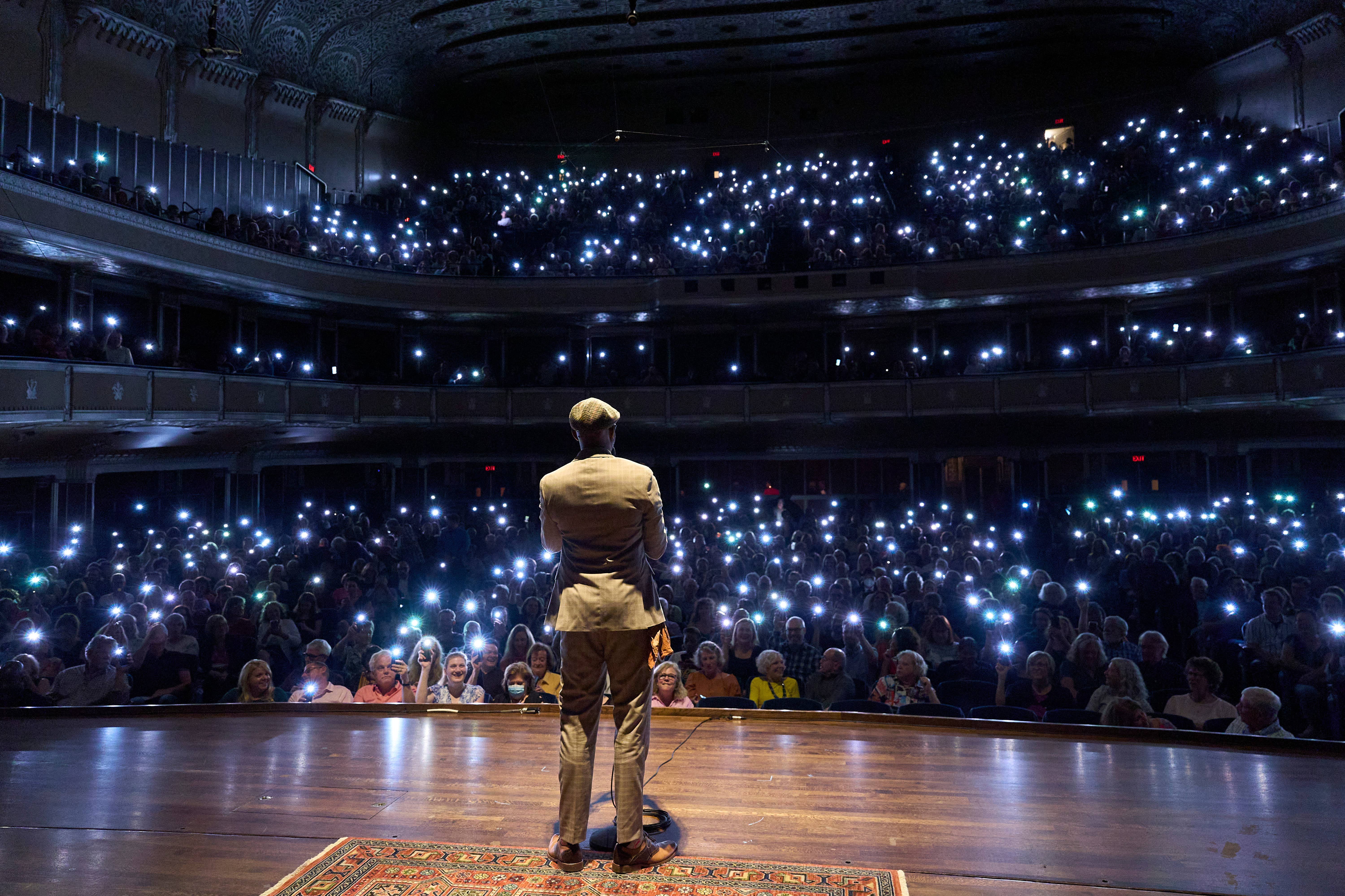 The Moth radio hour audience phone lights viewed from stage