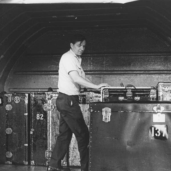 A worker loads a plane with cargo for the Orchestra’s 1970 tour to Asia.