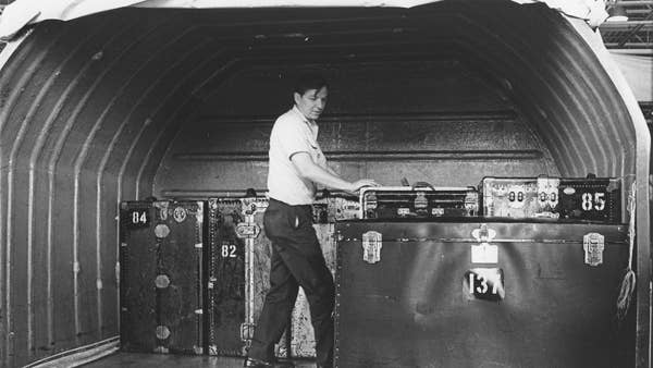 A worker loads a plane with cargo for the Orchestra’s 1970 tour to Asia.