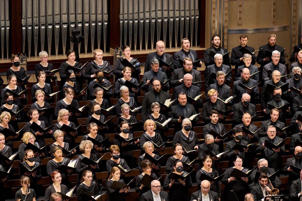 Chorus members singing