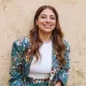 Dalia standing in front of a wall