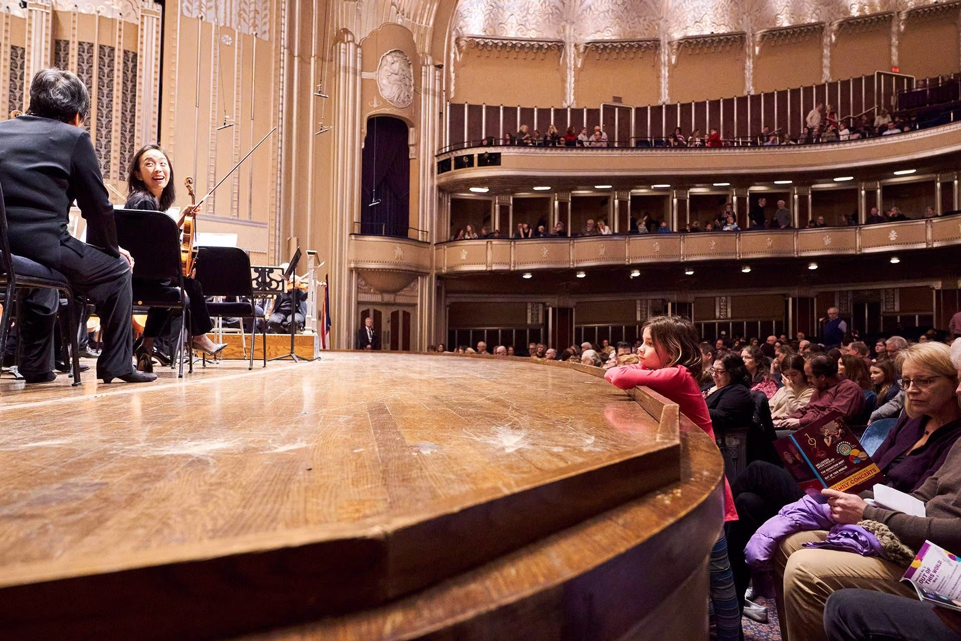 Girl leaning on concert stage before performance
