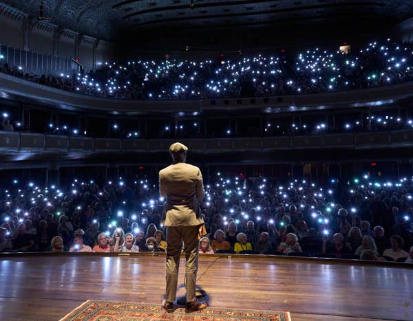 The Moth radio hour audience phone lights viewed from stage