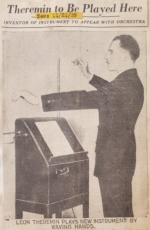A newspaper heading reads 