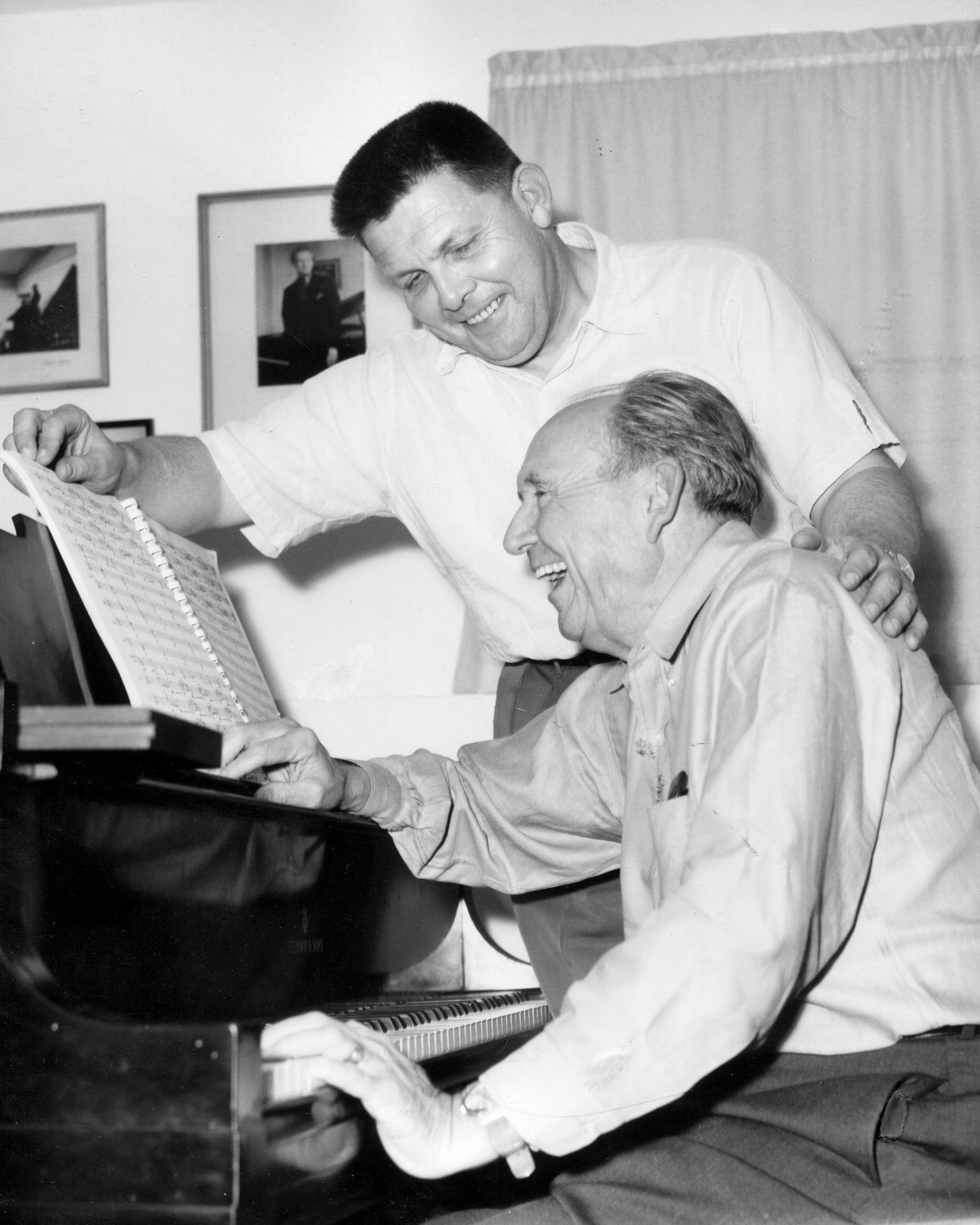 Harris (seated) playing piano with his former student George Lynn