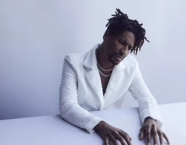 Jon Batiste in white blazer