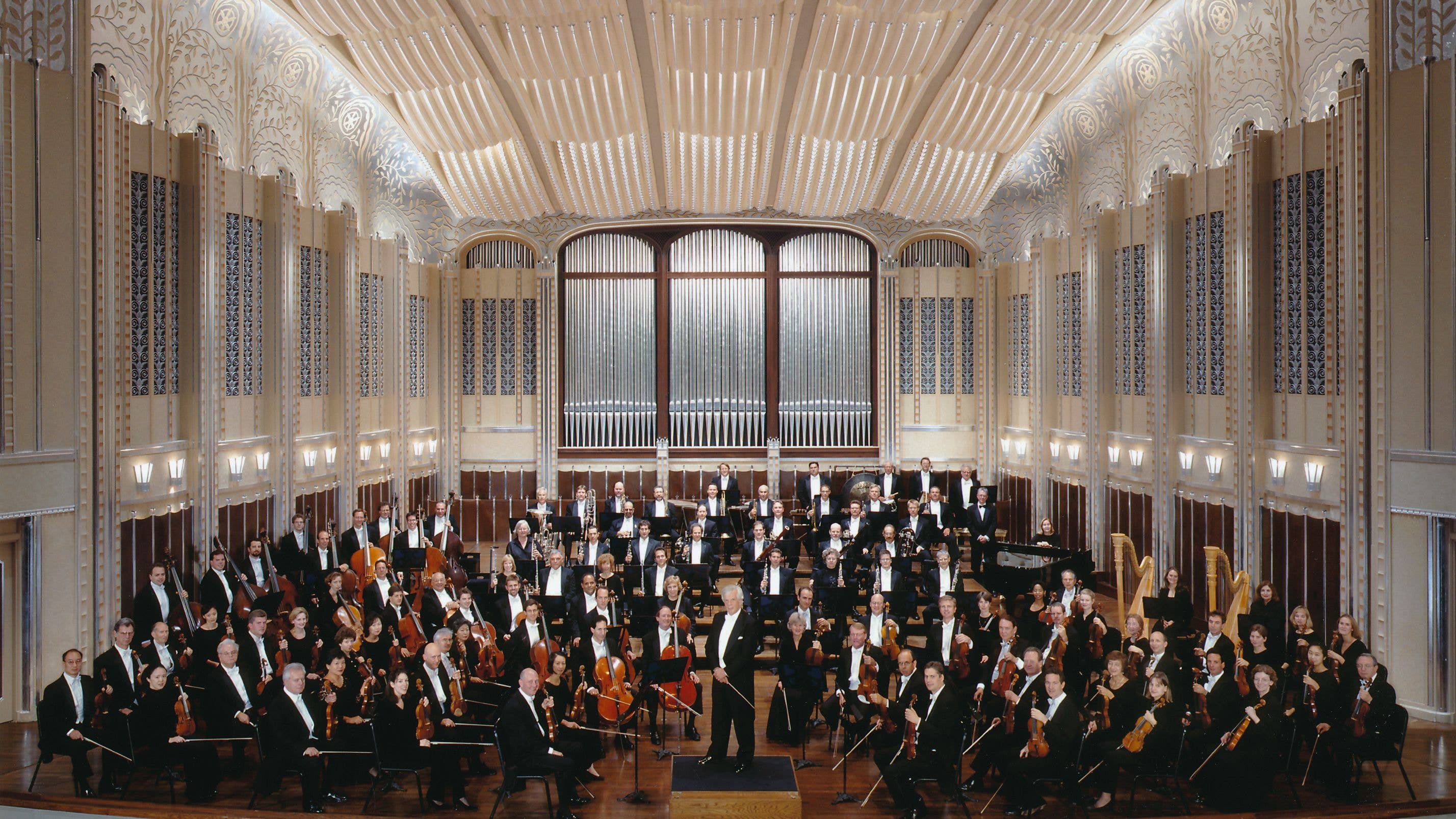 The Orchestra is seated on stage in Severance Hall, with von Dohnányi standing on the podium and looking towards the camera.