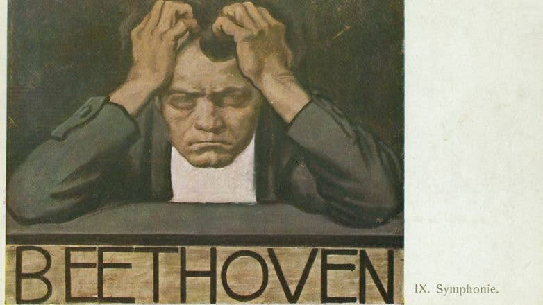 Beethoven, holding his head in his hands, has a pained expression and looks to be deep in thought.