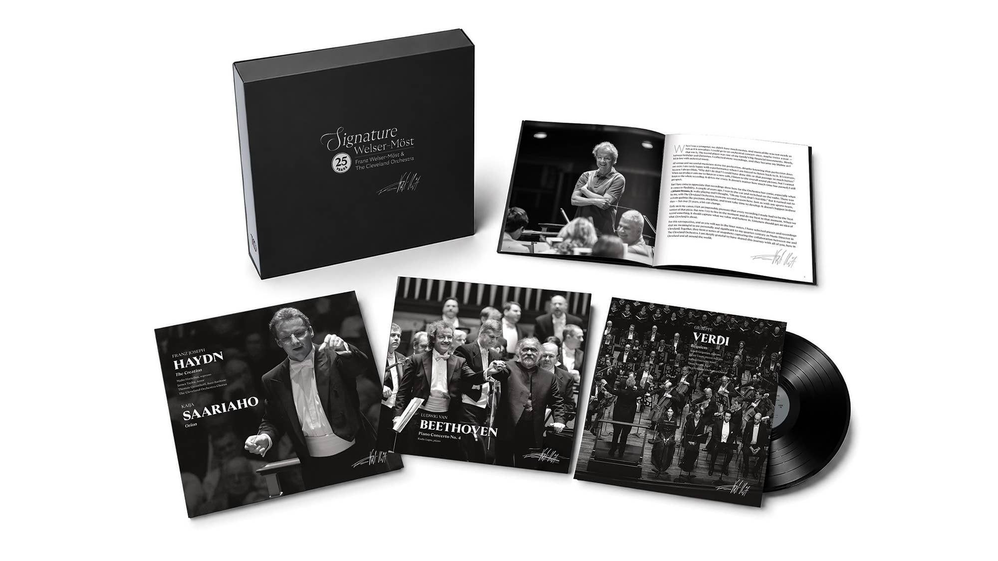 Set of classical music album packaging: booklet, CD case, photos, and vinyl record with orchestra artwork.