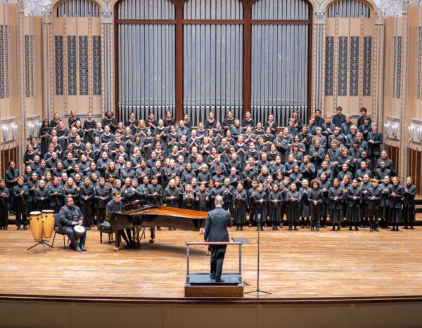 TCO Youth Choirs on Mandel stage, singing. 