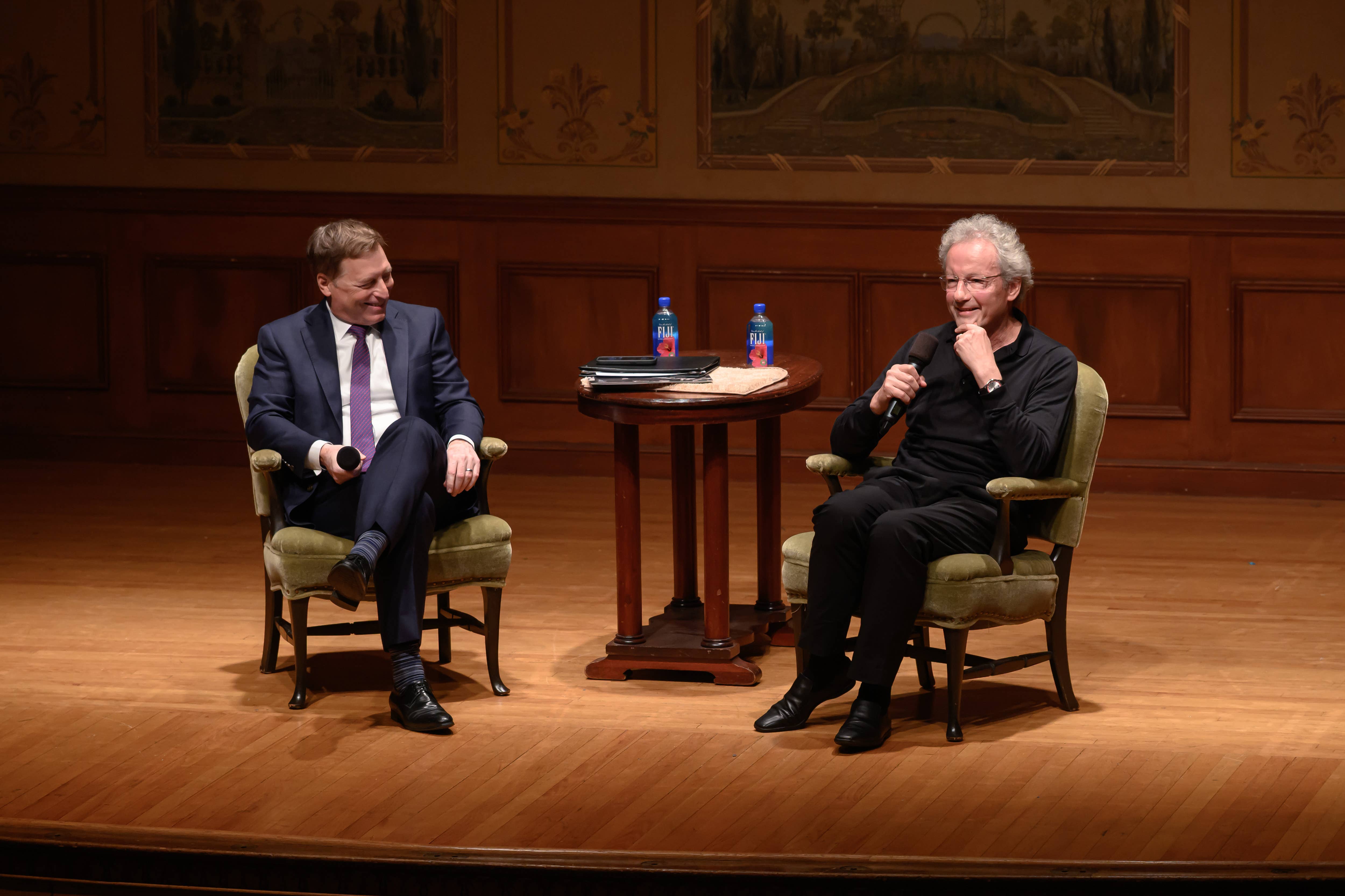Andre Gremillet and Franz Welser-Most speaking on Reinberger stage during pre-concert talk