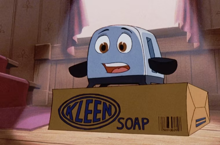 The brave little toaster stands on top of a Kleen Soap box looking shocked at what it sees.