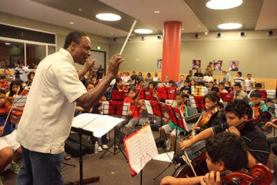 Thomas conducting students at YOLA at Expo Center