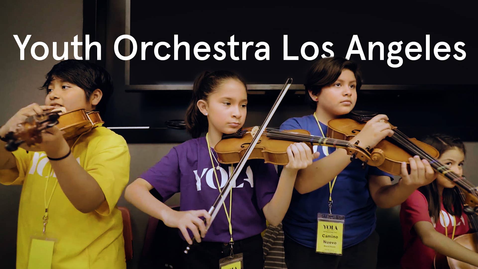 Three kids play the violin with text reading 