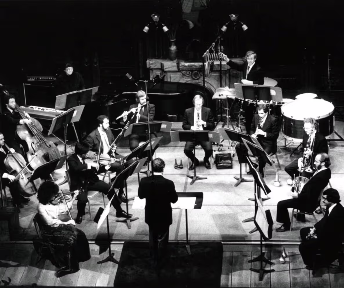 black and white photo of the New Music Group performing on stage