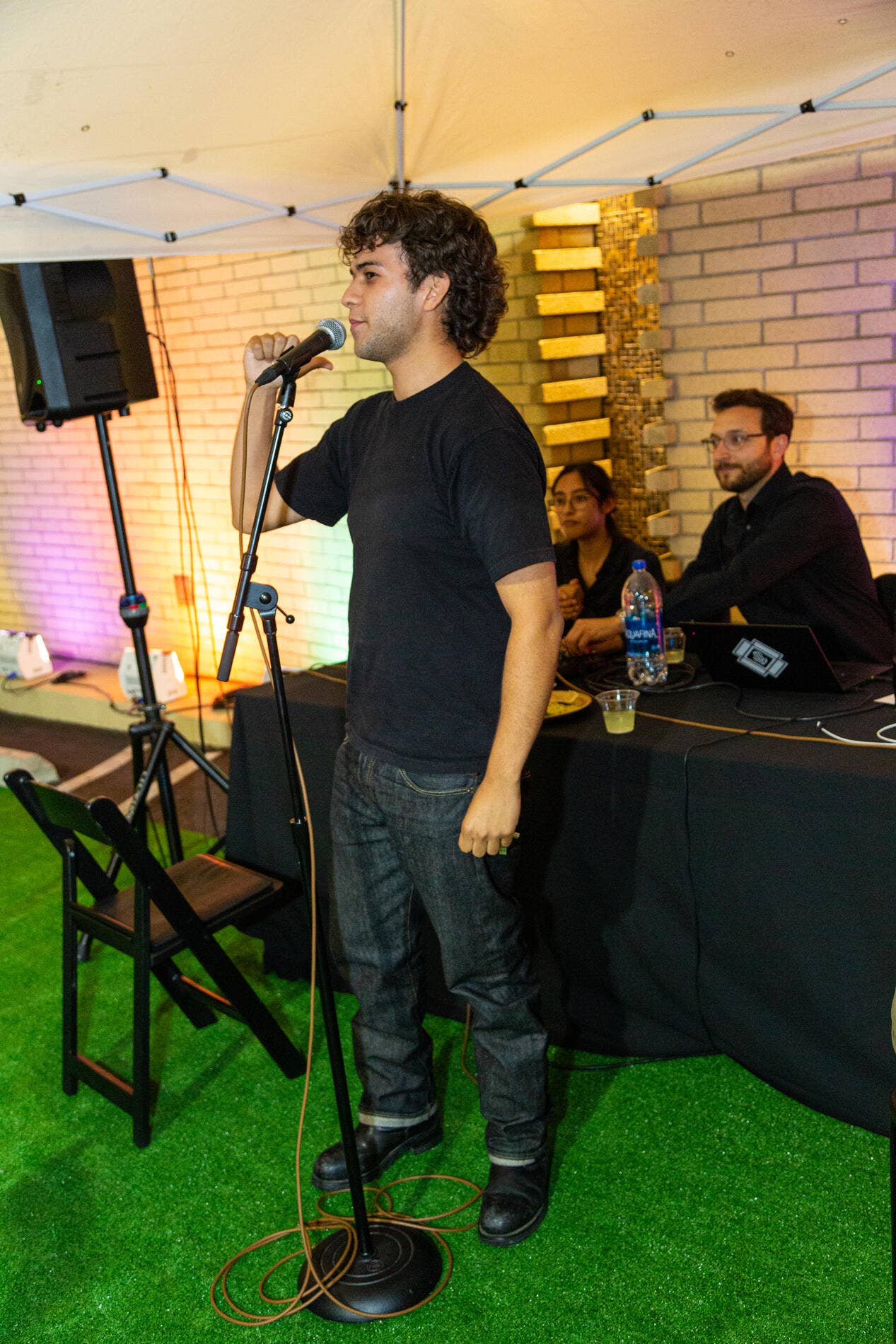 Carlos Cano performs a mic check during the YOLA Soirée in 2023. 