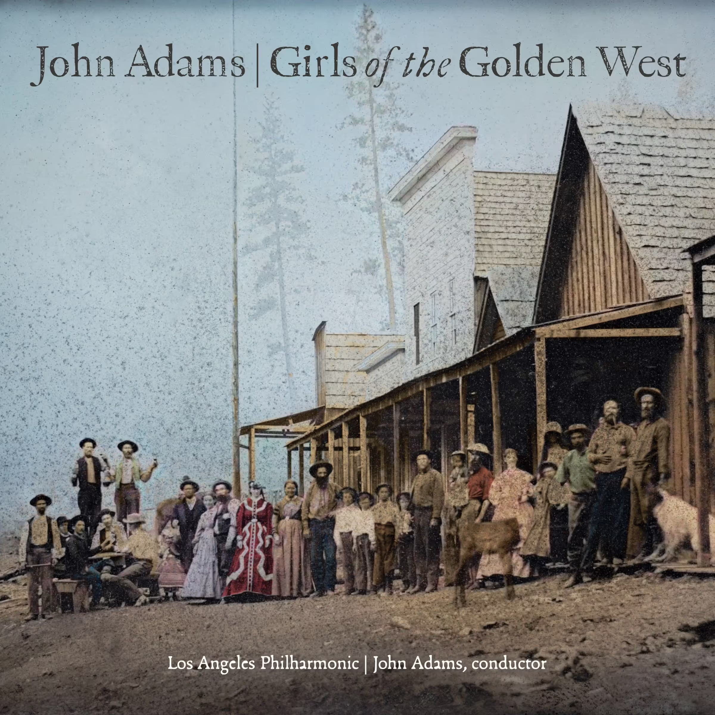 Group of people posing outside wooden church-like building, with text reading John Adams, Girls of the Golden West
