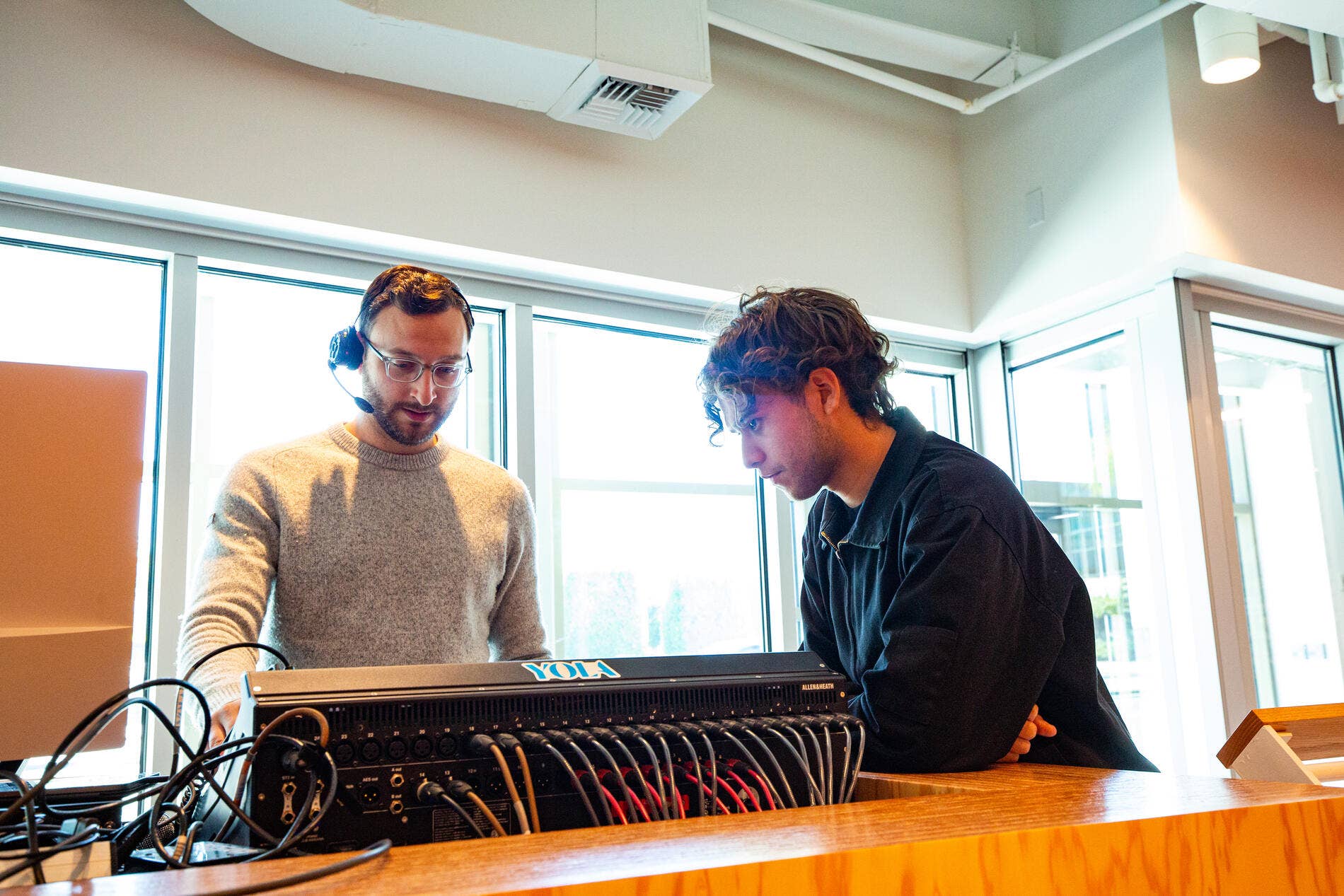 A Workforce Development Program participant learns about audio tools.